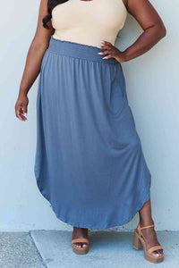 The Nina High Waist Scoop Hem Maxi Skirt in Dusty Blue